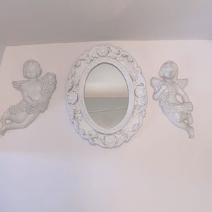 Baroque cherubs and mirror.